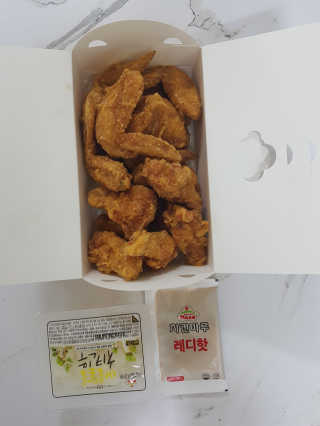 [치킨마루]-  빠사칸윙봉현미 + 콜라 500ml — 5점을 준 리뷰어가 2019년 7월 올린 사용 사진