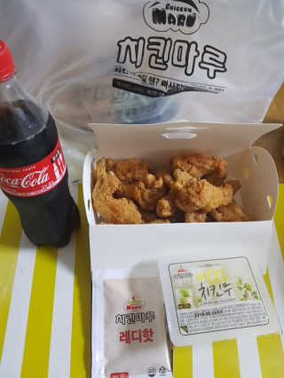 [치킨마루]-  빠사칸윙봉현미 + 콜라 500ml — 5점을 준 리뷰어가 2019년 7월 올린 사용 사진